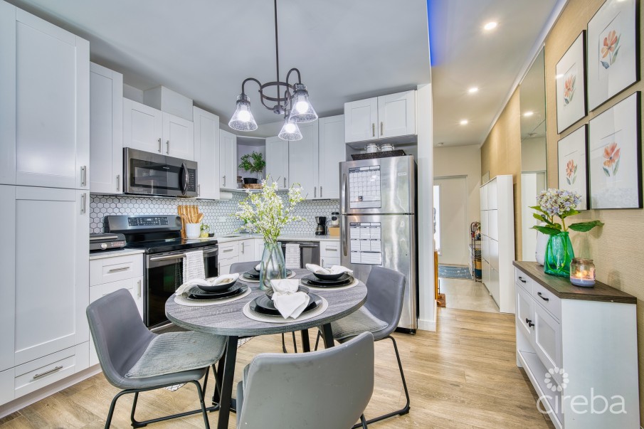 LIGHTHOUSE MANOR #6- CHIC 1-BEDROOM TOWNHOME IN GATED WEST BAY COMMUNITY - Image 1