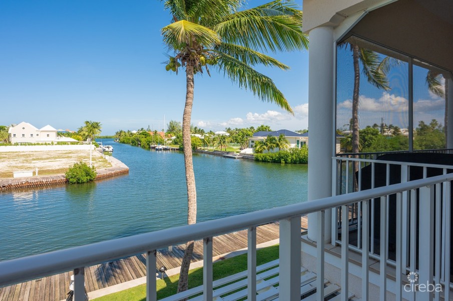 OLIVIA’S COVE #6 | GOVERNORS HARBOUR | CANAL FRONT CONDO - Image 1