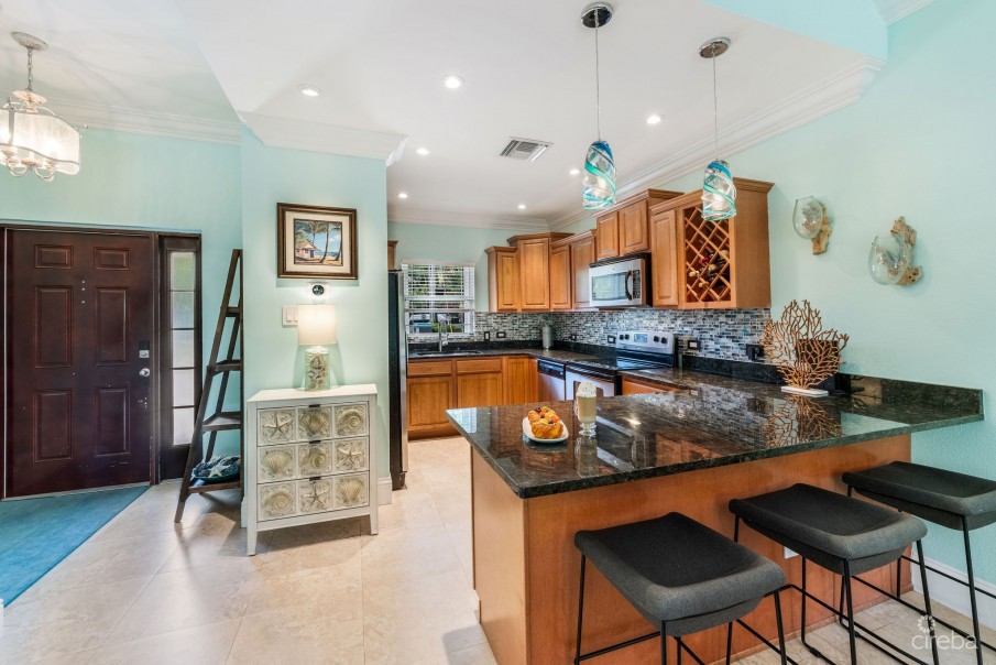 UPGRADED COASTAL ESCAPE CANAL FRONT TOWNHOUSE - Image 2