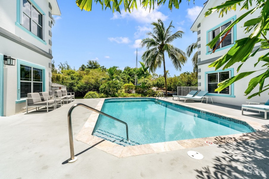 UPGRADED COASTAL ESCAPE CANAL FRONT TOWNHOUSE - Image 24