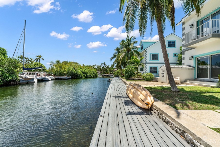 UPGRADED COASTAL ESCAPE CANAL FRONT TOWNHOUSE - Image 22