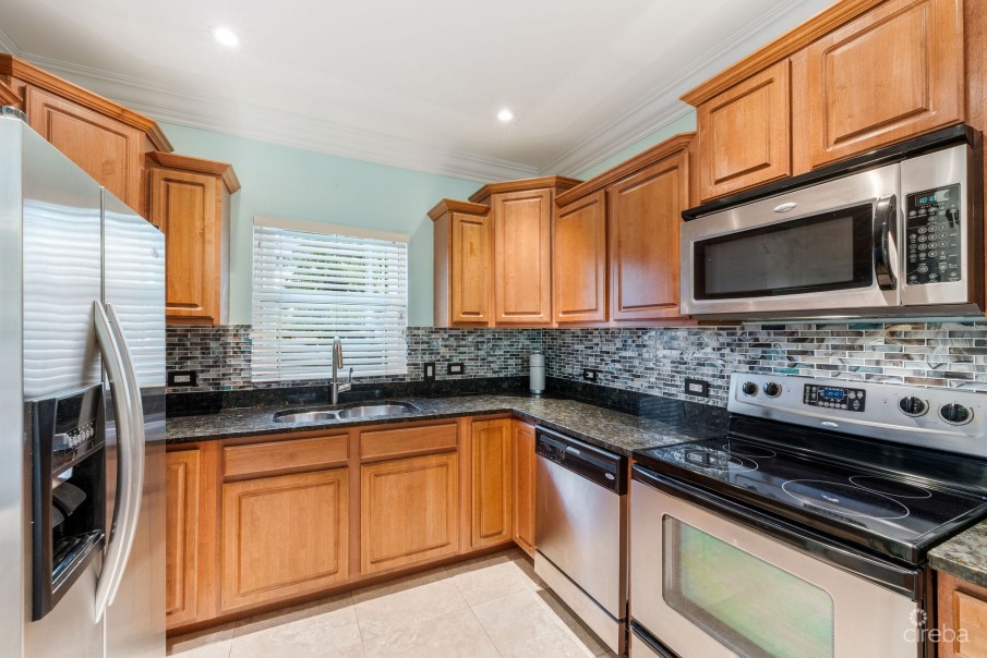 UPGRADED COASTAL ESCAPE CANAL FRONT TOWNHOUSE - Image 3