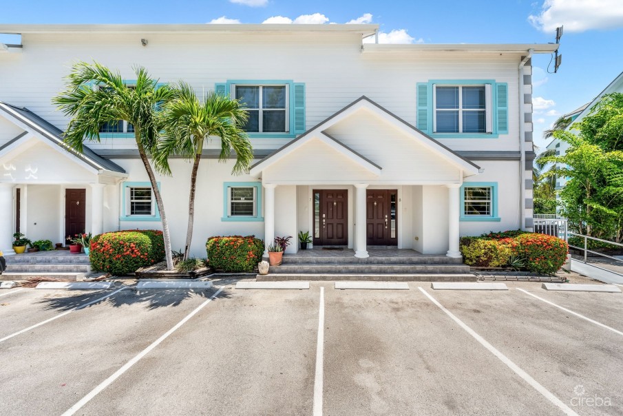 UPGRADED COASTAL ESCAPE CANAL FRONT TOWNHOUSE - Image 1